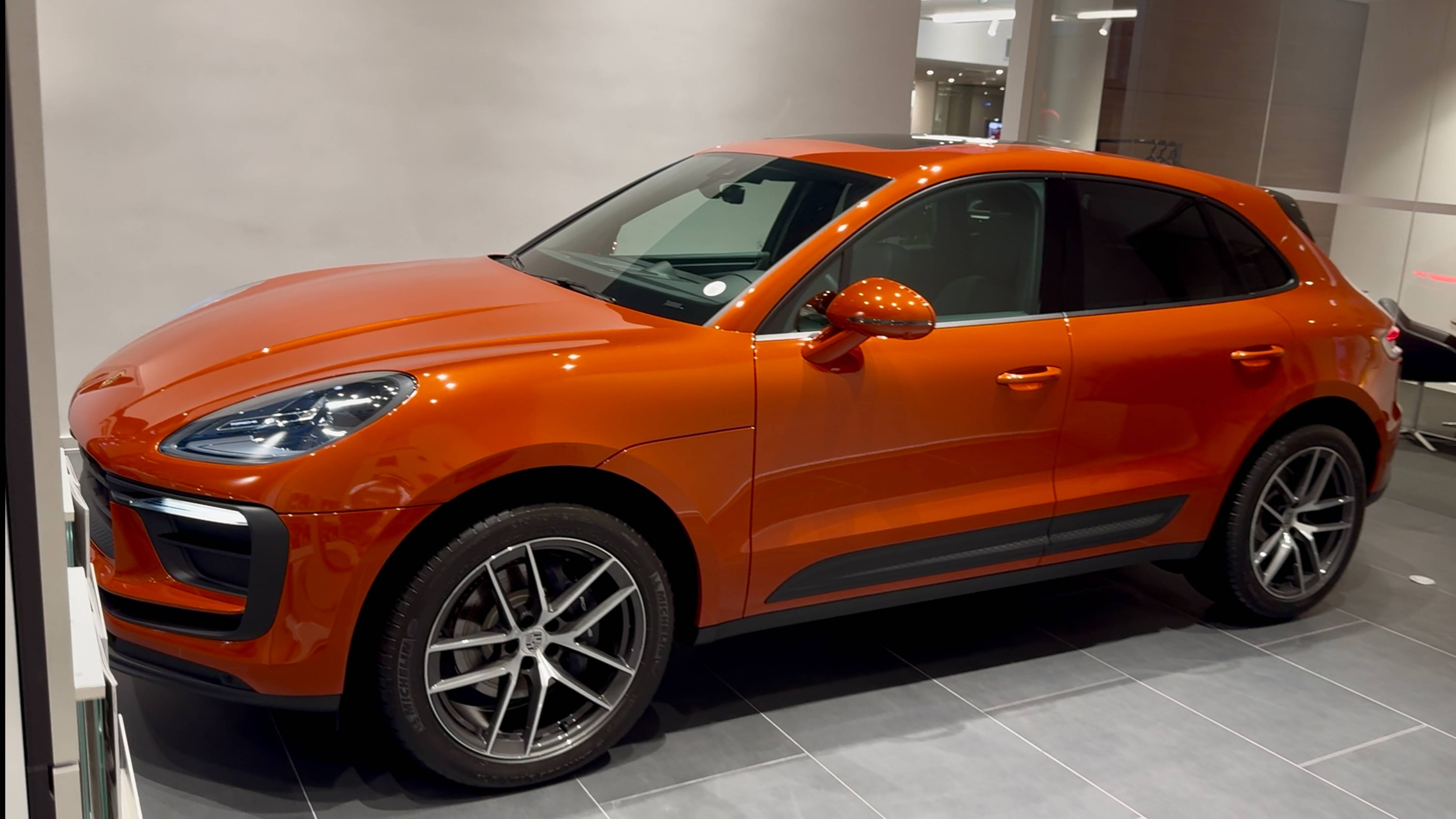 Porsche Macan 2024. Papaya Orange, Black.