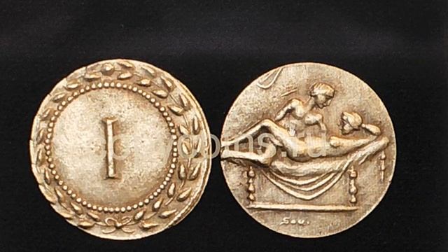 Монеты и бордельные жетоны древнего Рима для расчета с проститутками